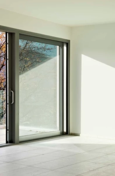 A fully restored sliding glass door repair in Miami, featuring clear glass and a repaired track.