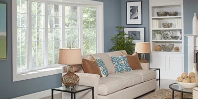 A happy Miami homeowner enjoying a cooler home after a window repair improved insulation.