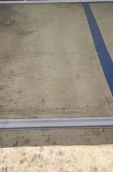 A technician performing a professional window screen repair in Miami with precision tools.