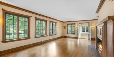 Certified technician inspecting a storm-damaged Window Screen Repair enclosure in a Coral Gables, Miami home.