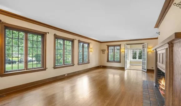 Certified technician inspecting a storm-damaged Window Screen Repair enclosure in a Coral Gables, Miami home.
