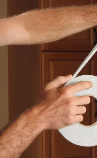 A cross-section view of a failed insulated glass unit (IGU) showing fogging and moisture trapped between the two panes of glass.